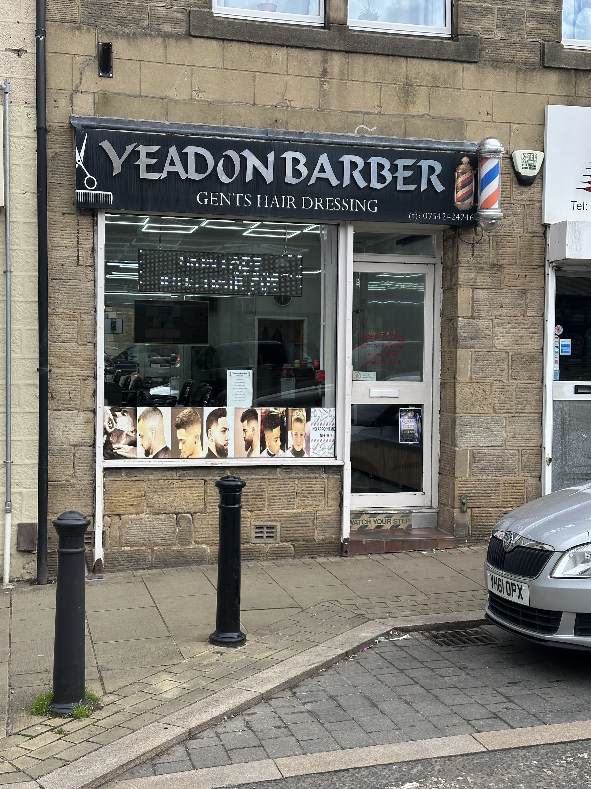 Yeadon Barber's stone shopfront and black sign at 67 High Street